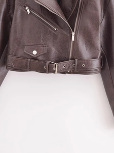 Detailed view of deep brown PU leather biker jacket with silver zipper and buckle belt