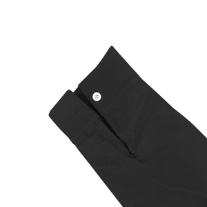 Close-up of black cotton linen shirt cuff with button detail and textured fabric weaving