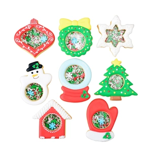 Christmas shaker cookie mold set featuring snowflake, snowman, and tree shapes
