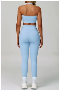 Rear view of light blue high-waist yoga leggings and matching crop top sports set