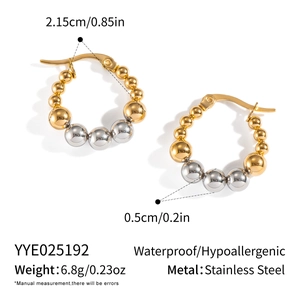 Detail showing two-tone gold and silver beaded hoop earrings in waterproof stainless steel