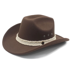 Detail of brown felt cowboy hat with woven band and gold M logo metallic badge