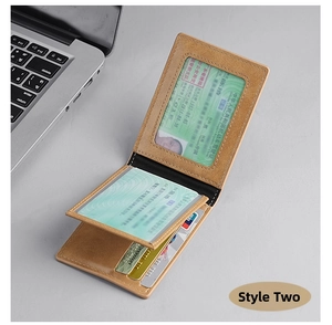 Detail view of brown leather slim wallet with multiple card slots and clear ID windows