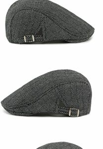 Detail of herringbone wool cap fabric and adjustable silver metal buckle on the side