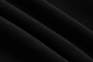 Gros plan détaillé du tissu en dentelle noire avec une texture de tissage textile fin