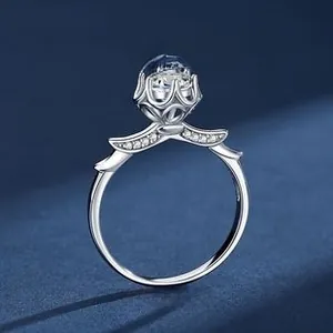 Detailed macro view of S925 silver crown ring featuring winged accents and a sparkling stone