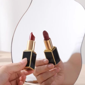 Irregular acrylic makeup mirror with stylish lipsticks for desktop photography decoration