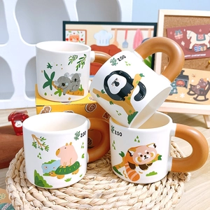 Cartoon animal ceramic mug set with chunky brown handles featuring koala and panda illustrations