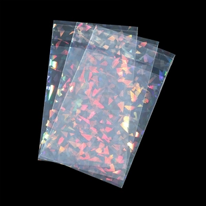 Close-up of holographic laser self-sealing bags with colorful geometric patterns for jewelry