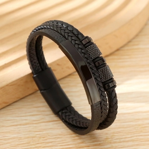 Detailed view of multilayer black woven leather bracelet with a magnetic alloy clasp