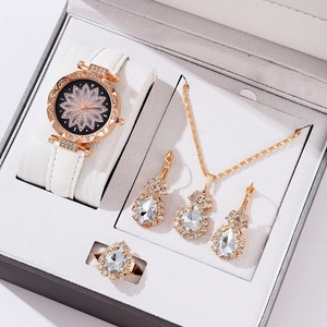 Detailed gift set view featuring white leather watch and teardrop jewelry with pavé crystals