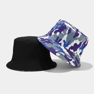 Reversible bucket hat with black solid color and purple camo pattern for outdoor sun protection