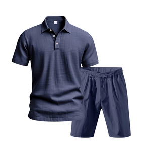 Detailed texture of men's navy blue linen polo shirt and drawstring shorts set