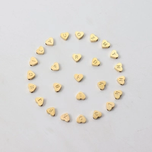 Golden heart-shaped metal beads with A-Z alphabet engravings for vintage pearl bracelets