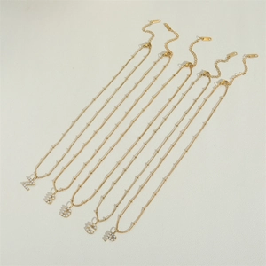 Gold stainless steel pearl necklace featuring vintage letter pendants Z B D G and P