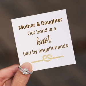 Detailed view of silver knot ring with emotional Mother & Daughter message card