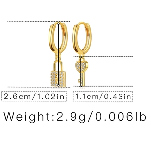 Detailed size chart for gold lock and key earrings with zircon accents and weight specs