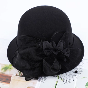 Elegant black wool felt bowler hat with mesh floral veil and vintage british style