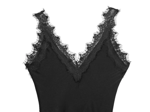 Close-up of black satin top featuring delicate eyelash lace trim on the V-neckline