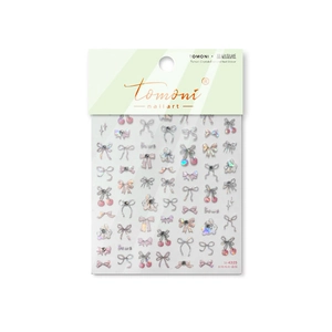 Sparkling crystal nail art stickers featuring pink bows and cherries on a white background