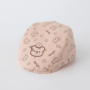 Close-up of baby beret featuring bear head embroidery and soft cotton texture