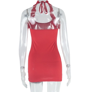 Detail view of the red halter backless bodycon dress with ruffled hem and slim fit