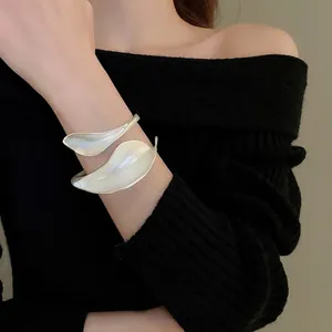 Matte silver leaf open cuff bracelet with an artistic wrap design for a luxury look