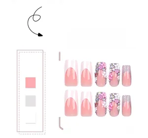 Detail of medium-long press-on nails with 3D flowers, pink gradient and rhinestones