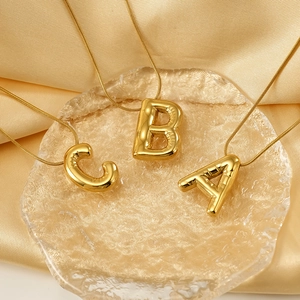 3D balloon alphabet necklace in gold finish with A, B, and C letter pendants for women