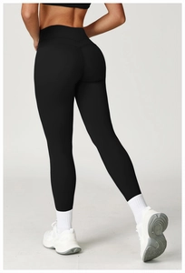 Detail showing high-waisted yoga leggings with V-shaped back seam for butt-lifting effect