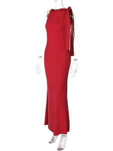 Detail of red sleeveless evening gown featuring a stylish shoulder ribbon drape