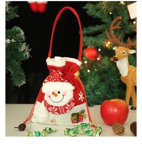 Close-up of burlap Christmas gift bag featuring a 3D snowman and drawstring closure