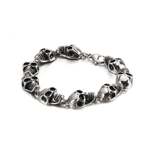 Gothic silver stainless steel bracelet featuring 3D skull links and lobster clasp closure
