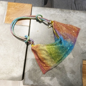 Detailed top view of rainbow rhinestone shoulder bag with gradient crystals and knotted strap