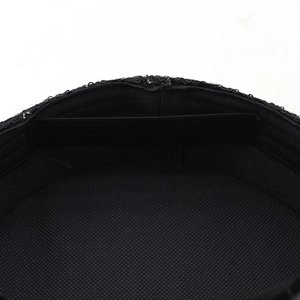 Detail of internal mesh lining and elastic adjustable strap on black sequined hat