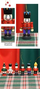 Detail view of mini 7cm wooden Christmas nutcracker soldiers with gold hanging strings