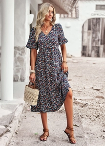Detail of V-neck printed midi dress with side slit and flutter sleeves in navy blue