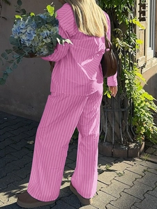 Rear view of a pink striped long sleeve shirt and wide leg trousers set for women