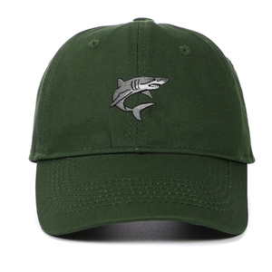 Detailed close-up showing the shark embroidery on this dark green cotton baseball cap