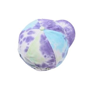 Detail of silver metal adjustable buckle and distressed brim on tie-dye baseball cap