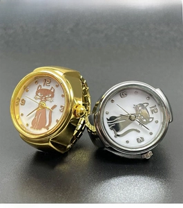 Macro view of gold and silver watch rings with elastic bands and cat dial design