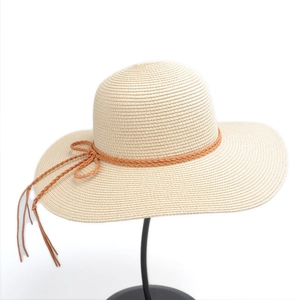 Women's wide brim straw sun hat with braided brown cord and bow for beach UV protection