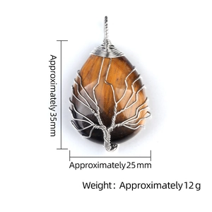 Tiger eye stone tree of life teardrop pendant wrapped in copper wire on white background