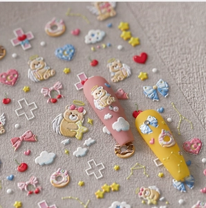 Detail view of 3D embossed nail stickers featuring cute bears and colorful sweet patterns