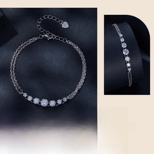 Detail of S925 sterling silver double-layer bracelet featuring round moissanite stones
