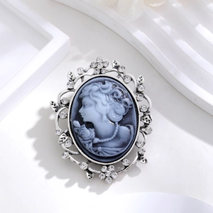 Vintage relief portrait brooch with blue-grey cameo and silver rhinestone floral frame