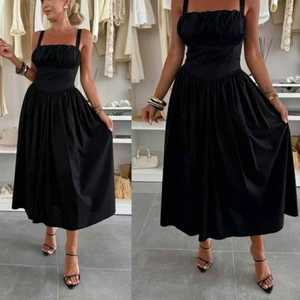 Detail of elegant black strapless dress with ruched bodice and a cinched waistline
