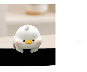 Close-up of cute white puppy animal computer monitor decoration with hook design
