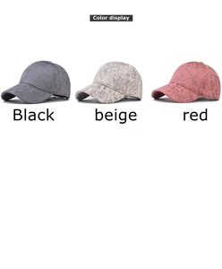 Detailed color display of tie-dye baseball caps in black, beige, and brick red