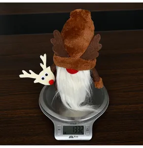 Detailed view of plush Christmas gnome weighing approximately 133g on a digital scale